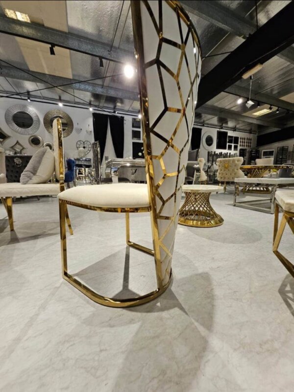 gold dining table with geo chairs