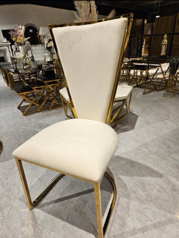 gold dining table with geo chairs