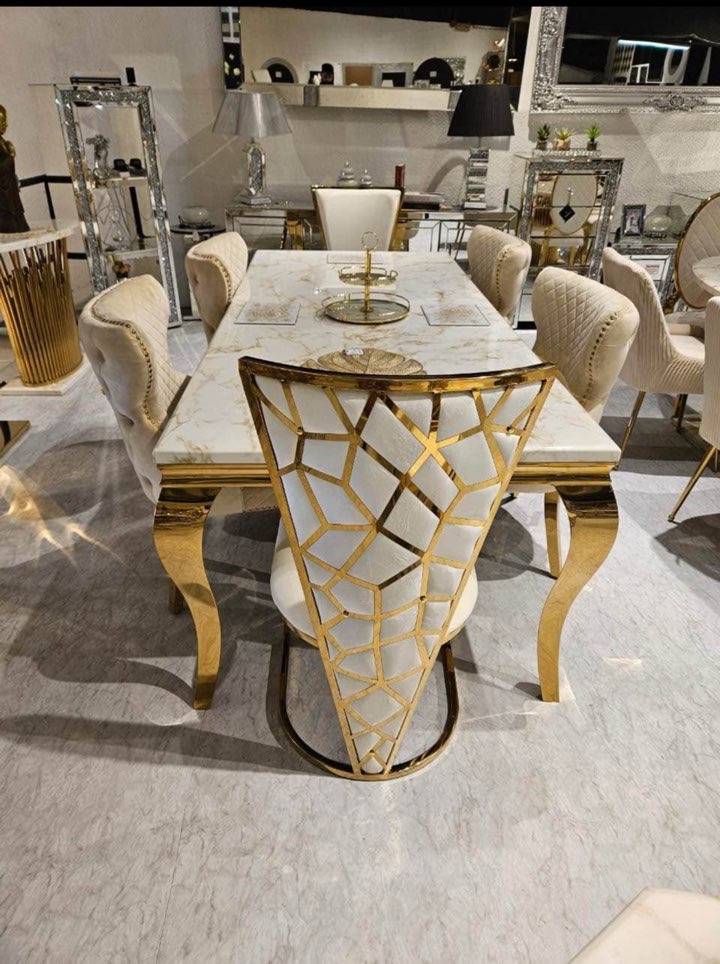 gold dining table with geo chairs