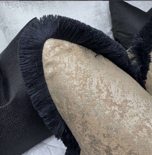 Brass fringed feather filled cushion