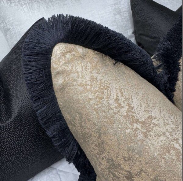 Brass fringed feather filled cushion