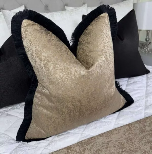 Brass fringed feather filled cushion